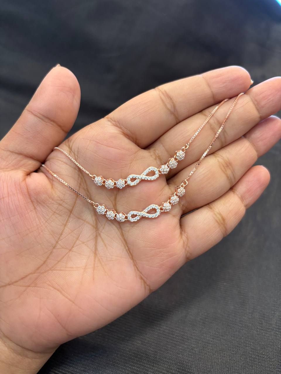 Silver infinity flower with rosegold finish Silver infinity flower with rosegold finish