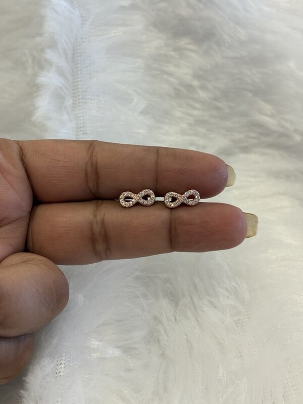 Silver infinity stud with rosegold finish