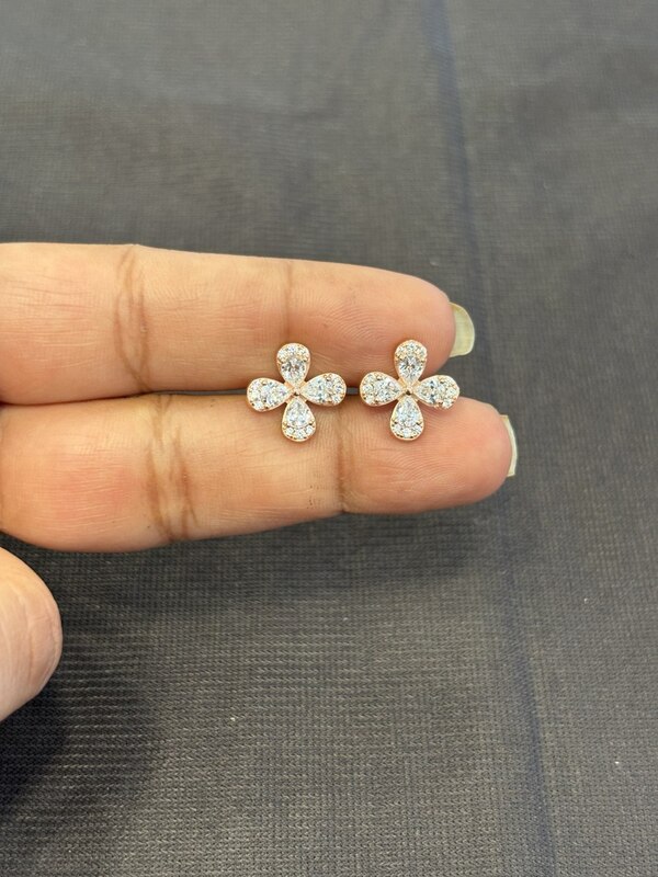 Silver four petal flower white stud with rose gold finish
