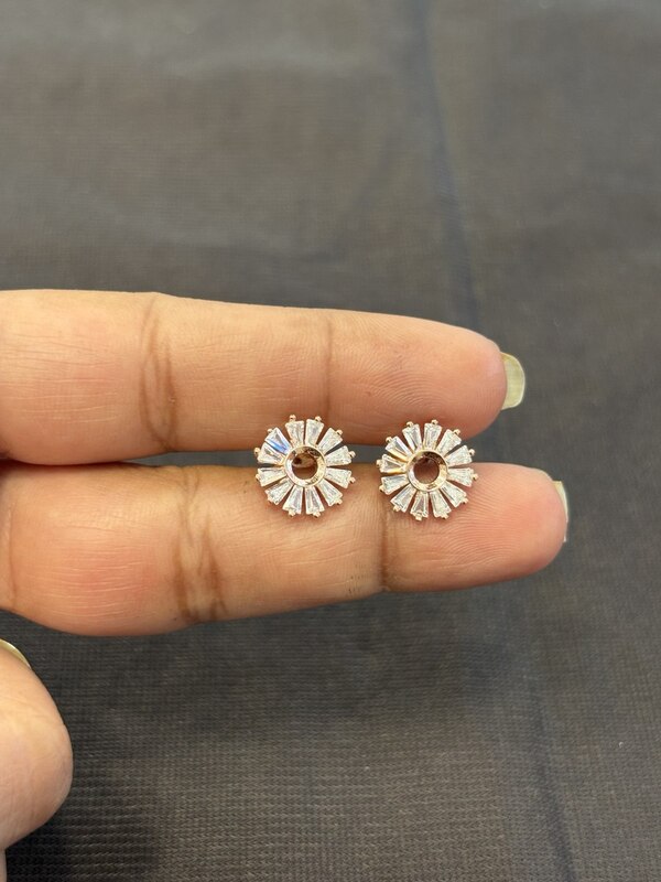 Silver colour round white stud with rose gold finish