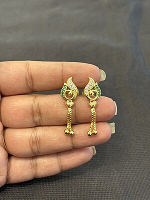 Silver casting peacock stud with gold finish