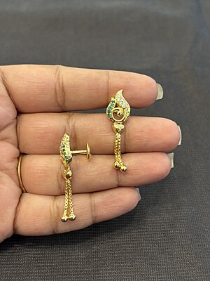 Silver casting peacock stud with gold finish