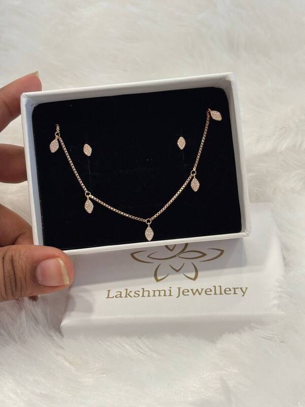Silver charms chain pendant set with rosegold finish