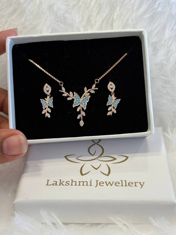 Silver blue butterfly chain pendant set with rosegold finish
