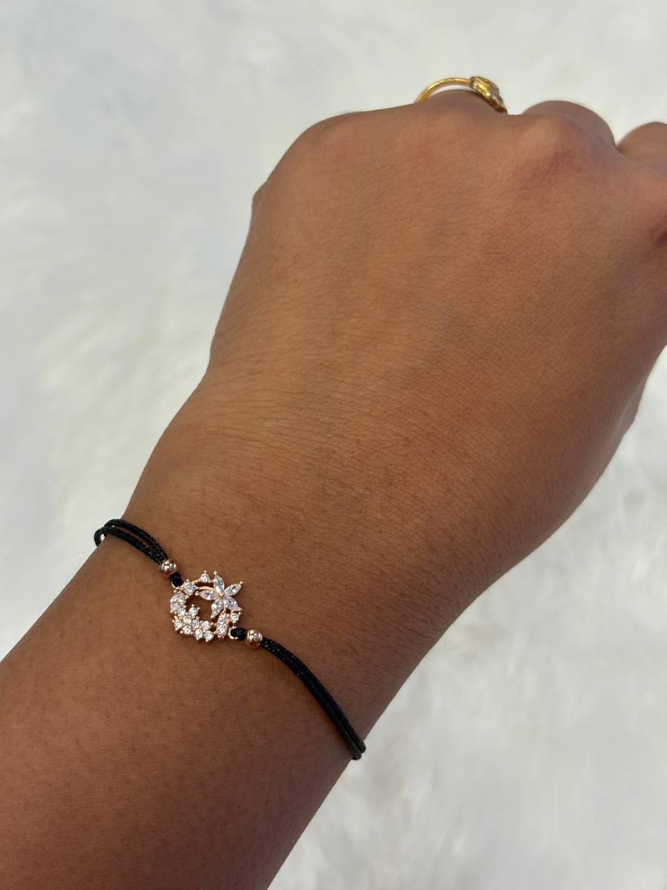Silver black rope flower bracelet with rose gold finish