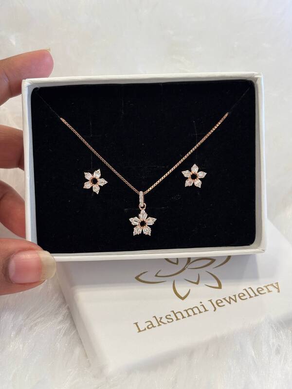 Silver flower hole chain pendant set with rosegold finish