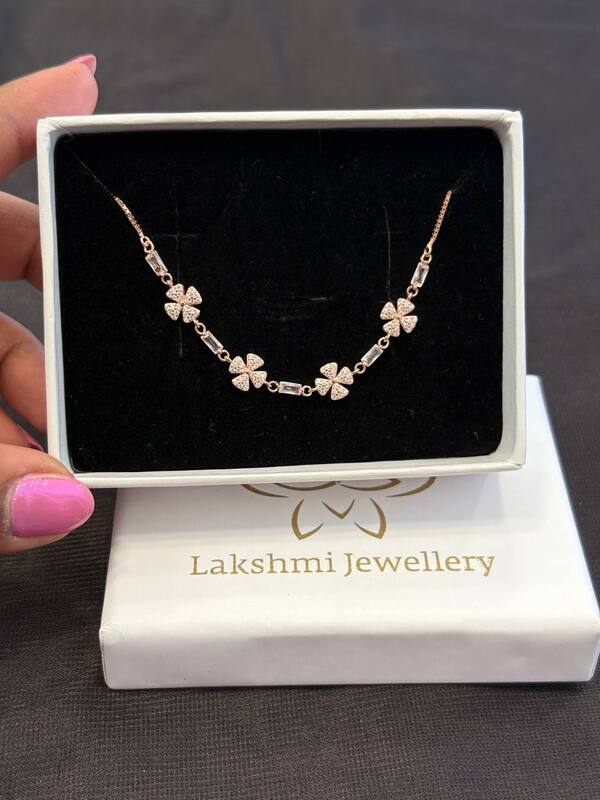 Silver four flower barcelet with rosegold finish